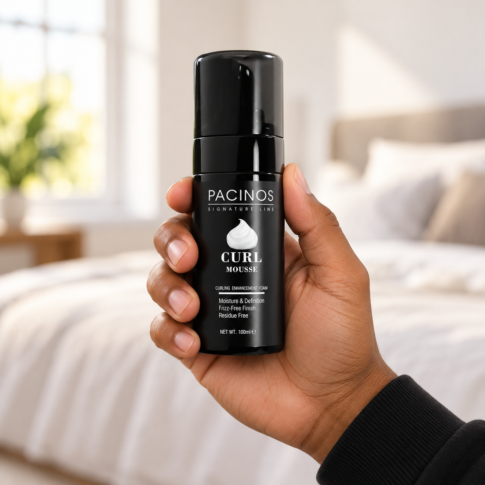 Pacinos Curl Mousse bottle held in a man's hand