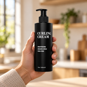 Pacinos Curling Cream 10 oz bottle held in a man's hand