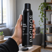 Pacinos Final Touch hair spray can held in a man's hand to show its size