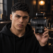 Young man with a matte textured haircut holding a jar of Pacinos Matte hair paste in a barbershop