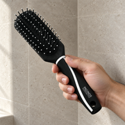 Pacinos Mid-Wide Brush in hand