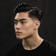 Man with a slicked-back high-shine hairstyle with a hard part styled with Pacinos Pomade