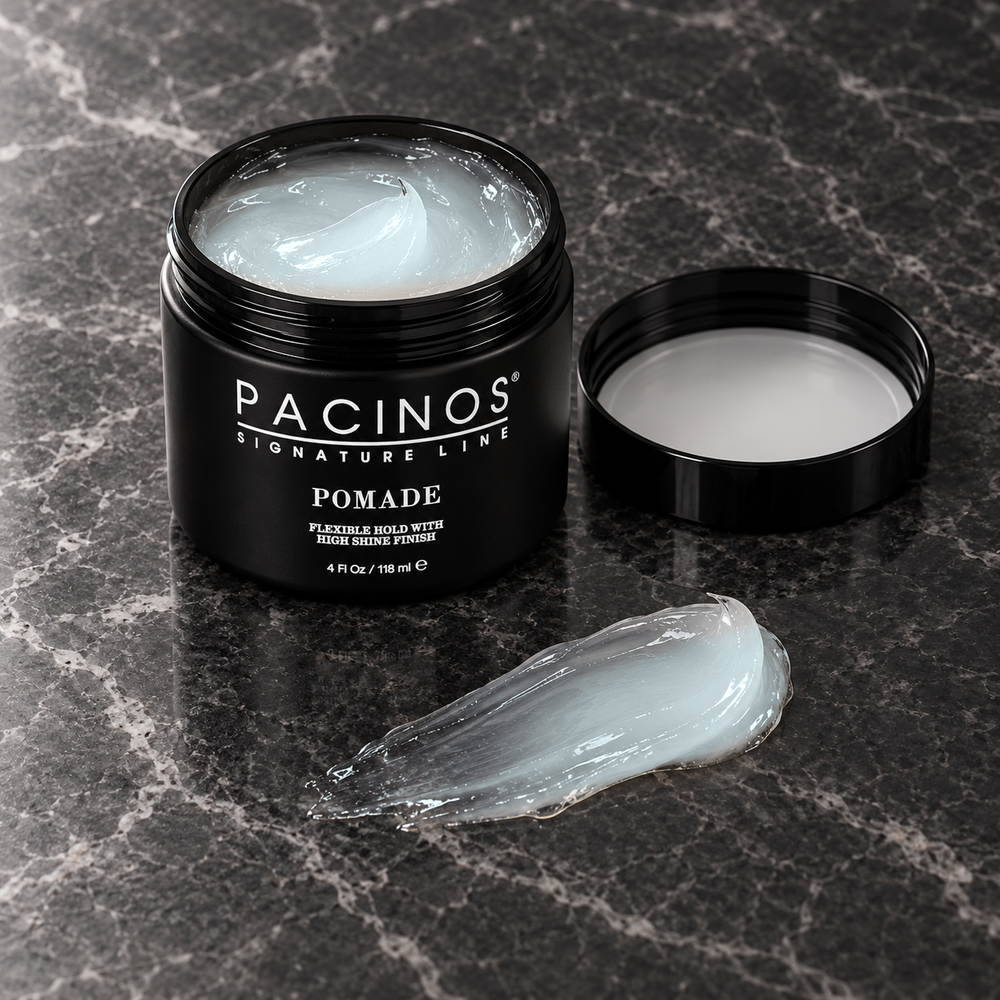 Pacinos Pomade: open 4 oz jar and a swipe of the clear icy-blue pomade on dark marble