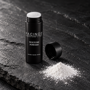 Open Pacinos Texture Powder shaker beside a pile of white powder on dark stone